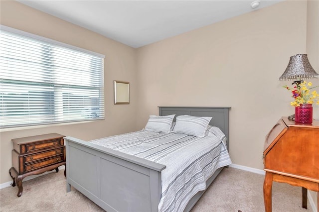 bedroom featuring light colored carpet