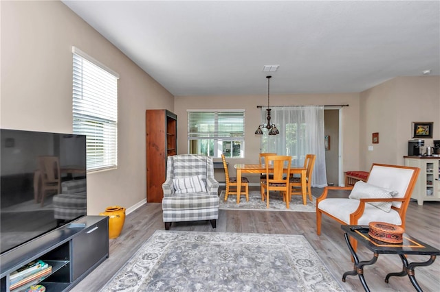 living room featuring light hardwood / wood-style floors and a wealth of natural light