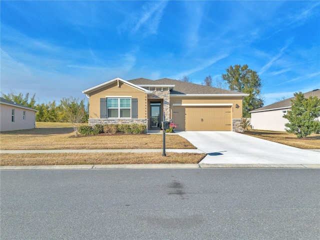 view of front of property with a garage and a front yard