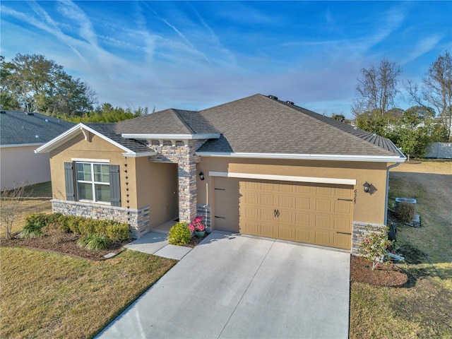 single story home featuring a garage and a front lawn