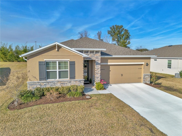 view of front of property featuring a garage and a front yard