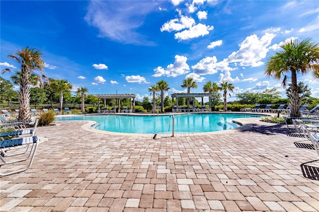 view of swimming pool with a pergola and a patio area