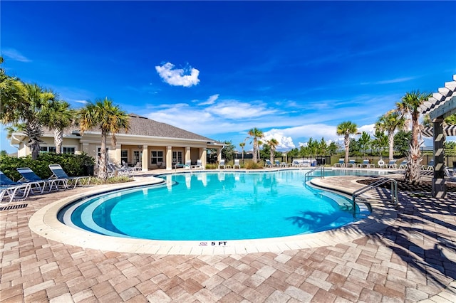 view of pool featuring a patio area