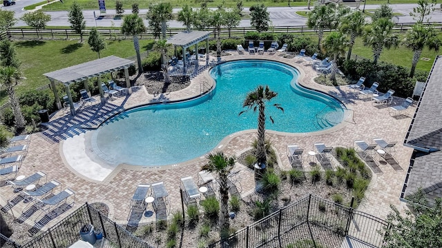 view of pool with a pergola and a patio