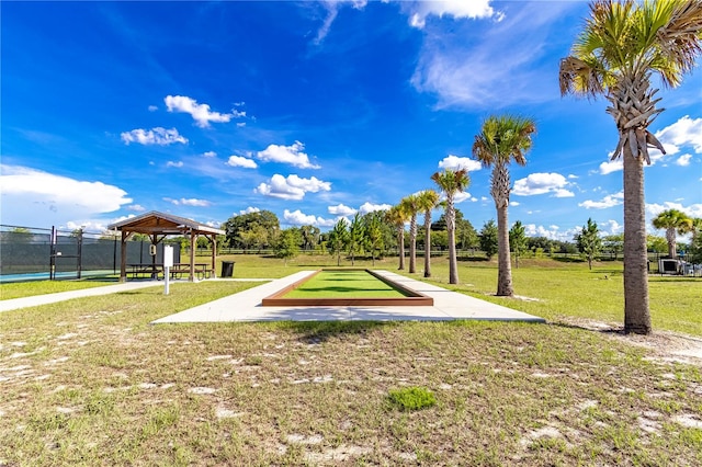 surrounding community with a gazebo and a yard