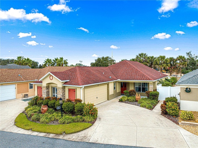 ranch-style home featuring a garage