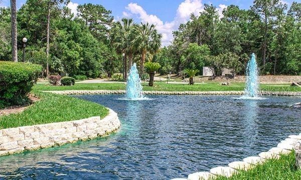 surrounding community featuring a water view