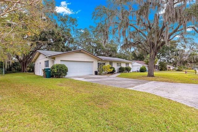 single story home featuring a front yard and a garage