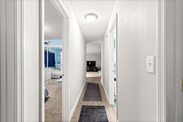 hallway featuring light wood-type flooring