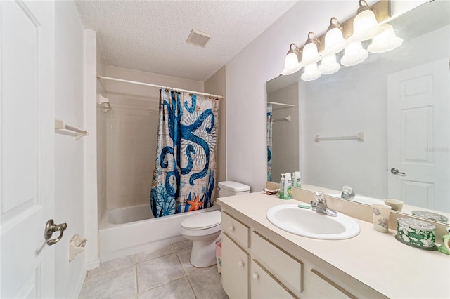 full bathroom with tile patterned floors, shower / bath combination with curtain, a textured ceiling, toilet, and vanity