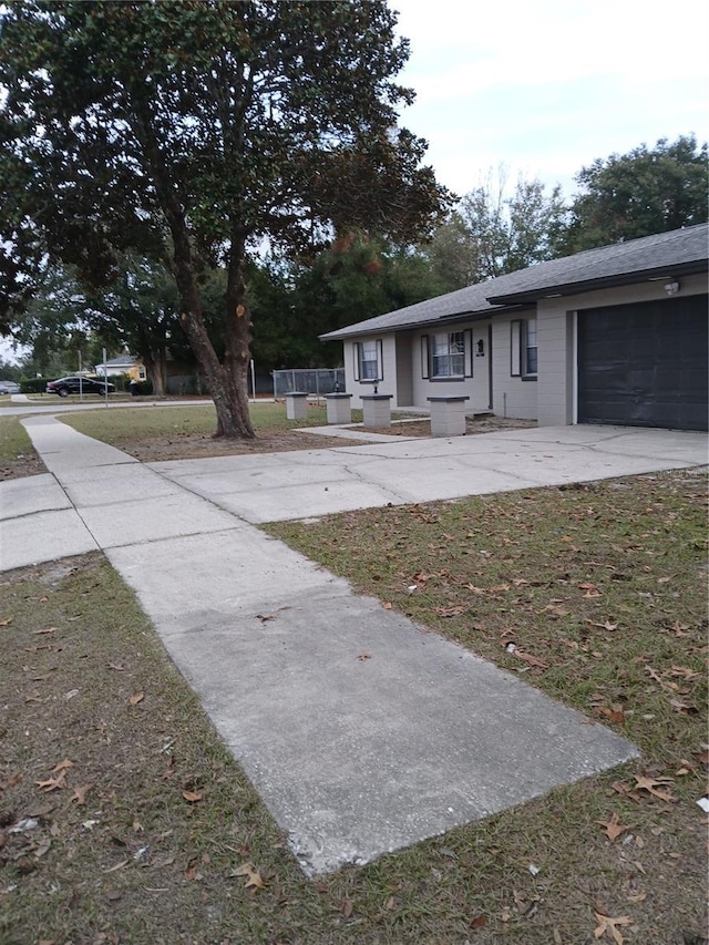 view of front of home with a garage and a front yard