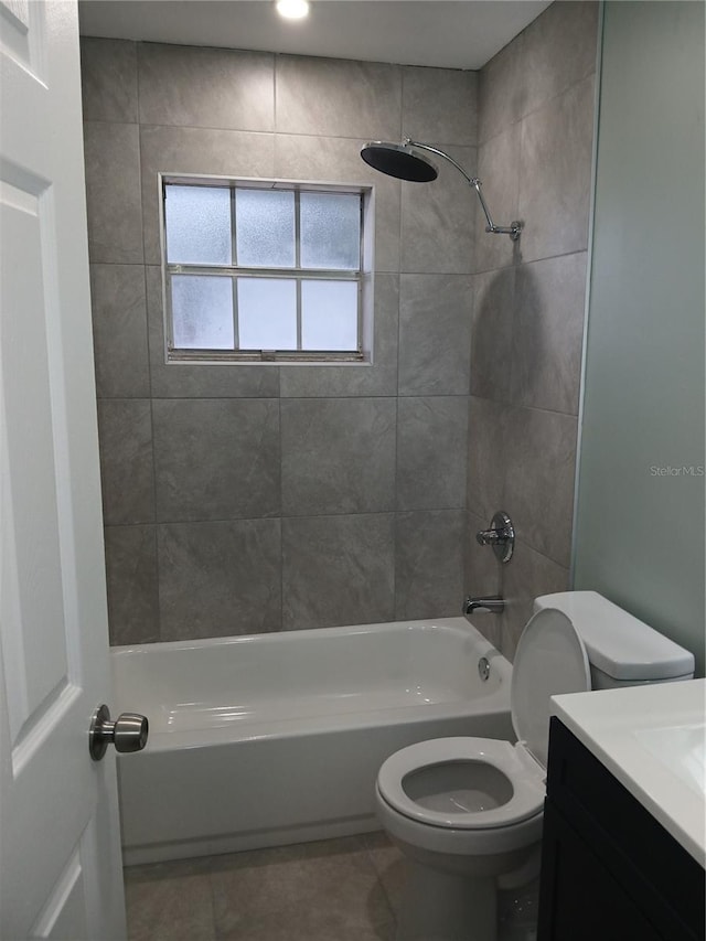 full bathroom with tile patterned floors, vanity, toilet, and tiled shower / bath