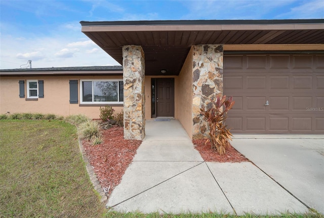 entrance to property featuring a garage