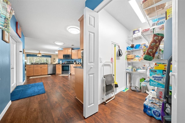 interior space with ceiling fan and sink