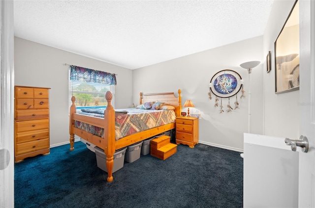 carpeted bedroom featuring a textured ceiling