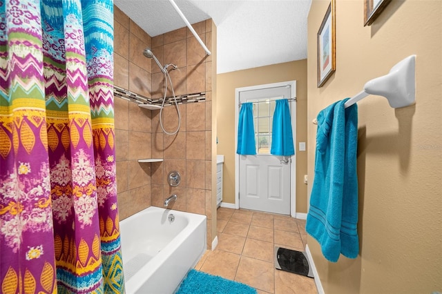 bathroom featuring tile patterned floors, shower / tub combo with curtain, and a textured ceiling