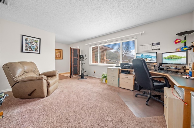 carpeted home office with a textured ceiling