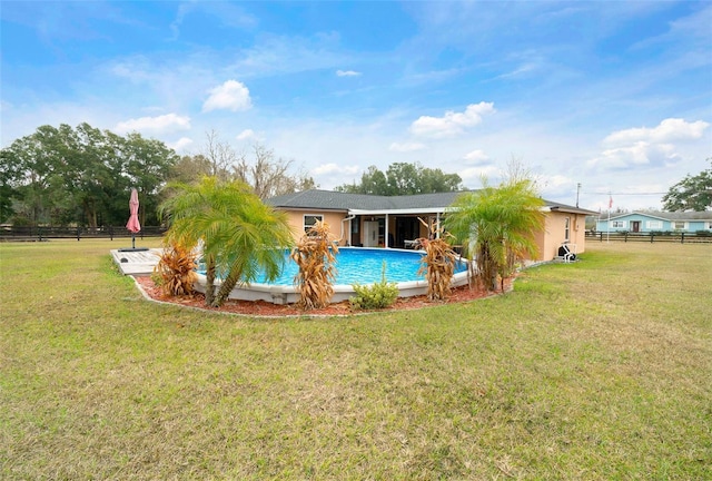 rear view of house with a lawn