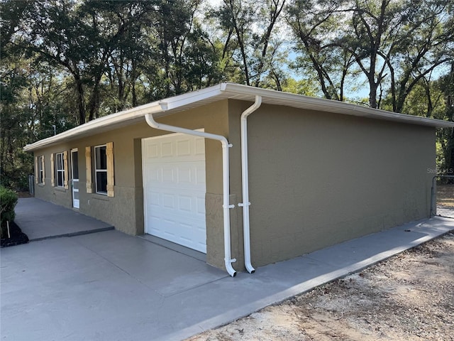 view of property exterior with a garage