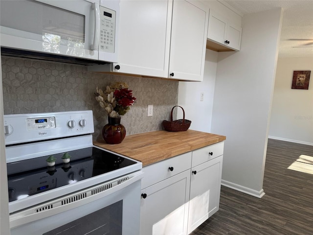 kitchen featuring white appliances, tasteful backsplash, butcher block countertops, dark hardwood / wood-style flooring, and white cabinetry