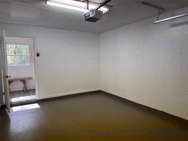 unfurnished room with concrete flooring and a textured ceiling