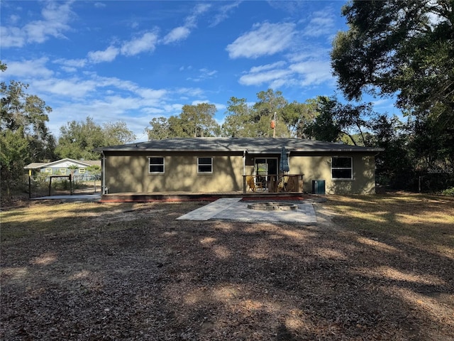 rear view of house featuring cooling unit