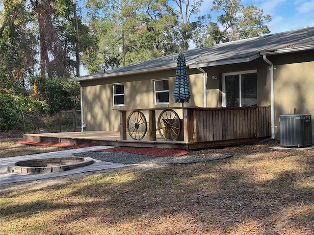 view of property exterior with central AC