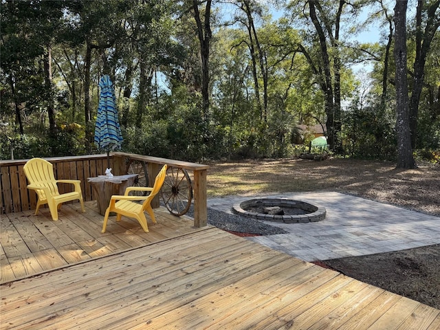 wooden deck featuring a fire pit