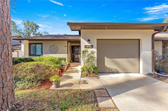 ranch-style home featuring a garage