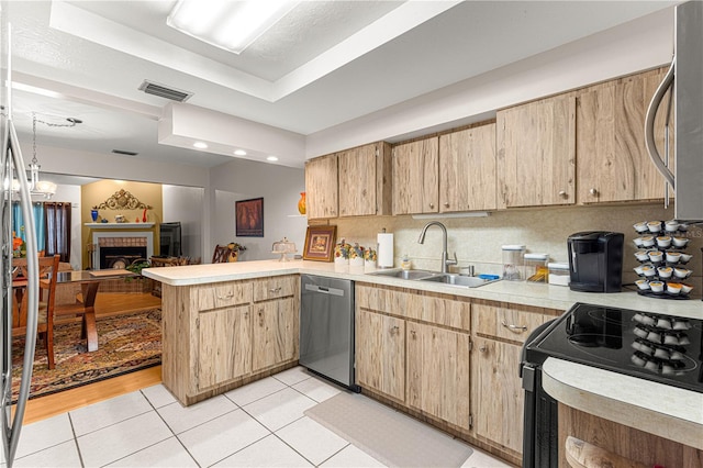 kitchen with dishwasher, sink, black electric range, kitchen peninsula, and light tile patterned floors