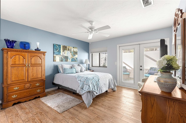 bedroom with ceiling fan, access to exterior, light wood-type flooring, and french doors