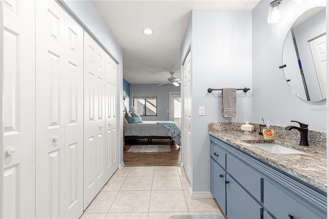 bathroom featuring ceiling fan, tile patterned flooring, and vanity