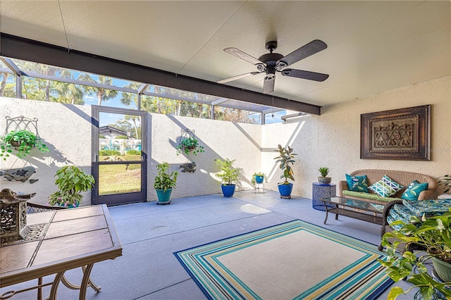 exterior space featuring ceiling fan