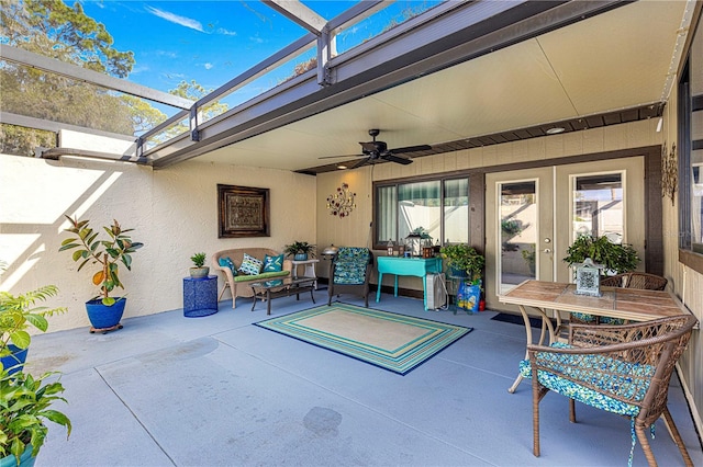 view of patio with ceiling fan, a lanai, and an outdoor hangout area