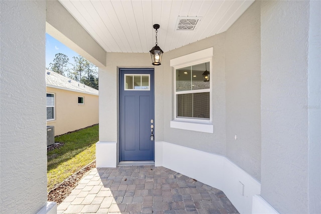 property entrance featuring central AC