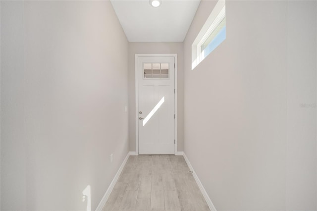 doorway with light hardwood / wood-style floors