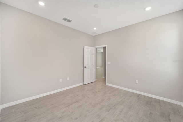 unfurnished room featuring light wood-type flooring