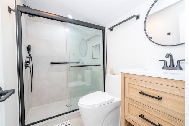 bathroom with vanity, toilet, and walk in shower