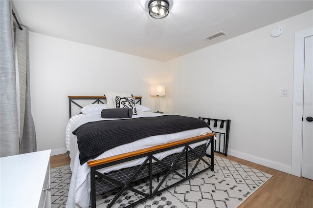 bedroom with hardwood / wood-style flooring