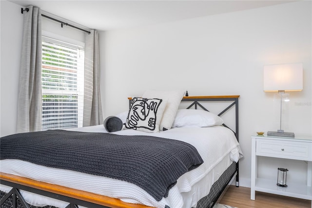 bedroom with wood-type flooring