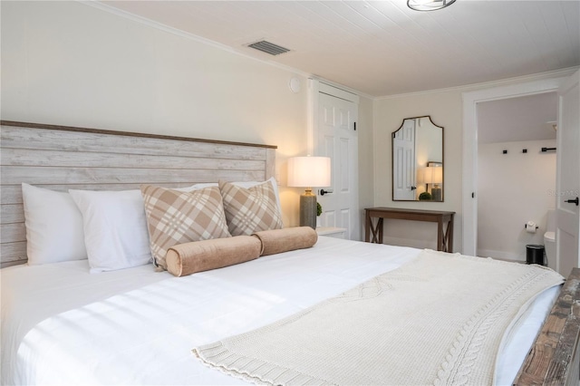 bedroom with crown molding