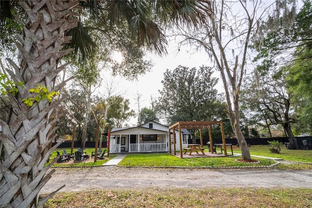 exterior space with a yard and a pergola