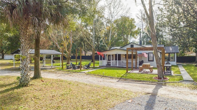 view of front of property featuring a patio area and a front lawn