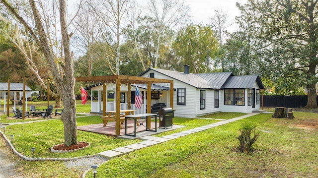 rear view of house featuring a lawn, a pergola, and a patio