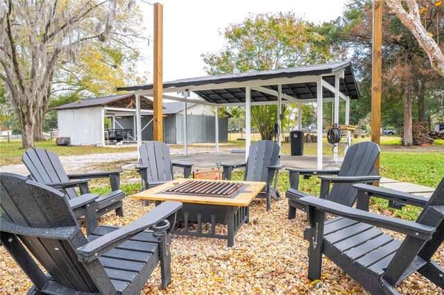 view of patio / terrace featuring an outbuilding