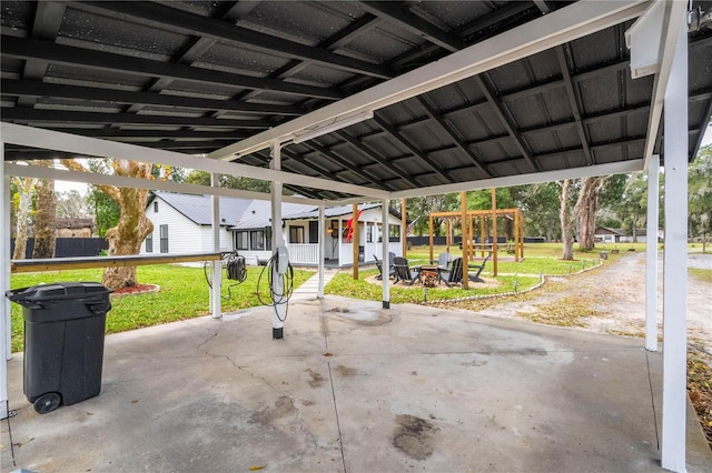 view of patio / terrace featuring a porch and a carport