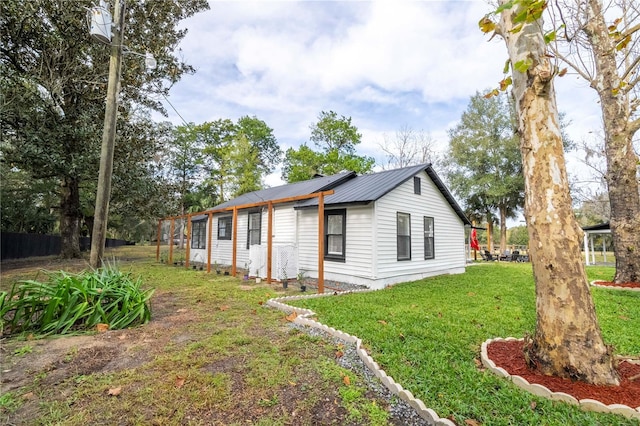 view of property exterior with a yard