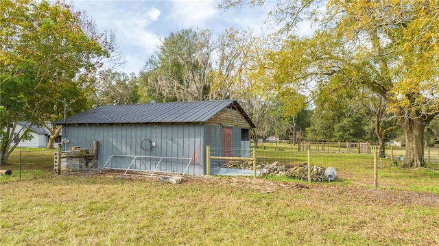 view of outbuilding featuring a yard