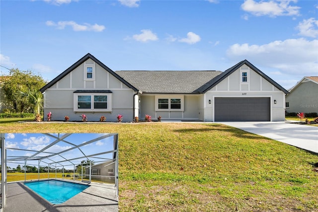 view of front of house with a front lawn, glass enclosure, and a garage