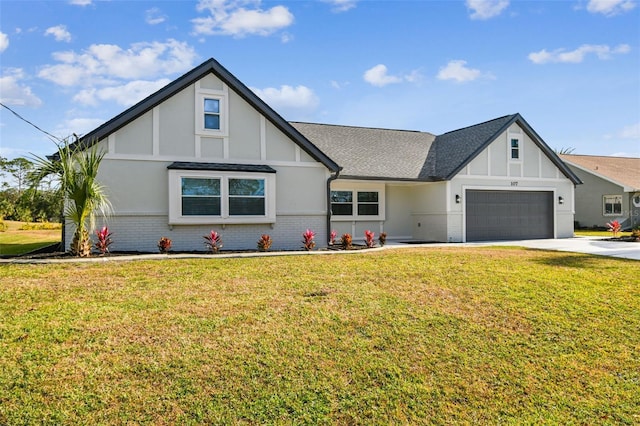 view of front of property with a garage and a front lawn